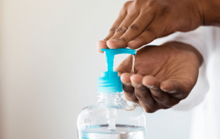 Person demonstrating hand sanitizer safety and proper use.